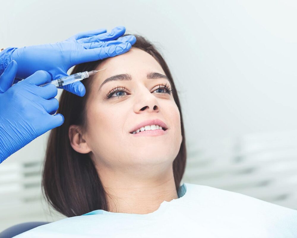 Happy women receive aesthetics treatment